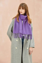 Full-length grey coat look with the Iris purple scarf draped long