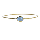 Euro Gold cuff bangle with a faceted soft blue London blue topaz