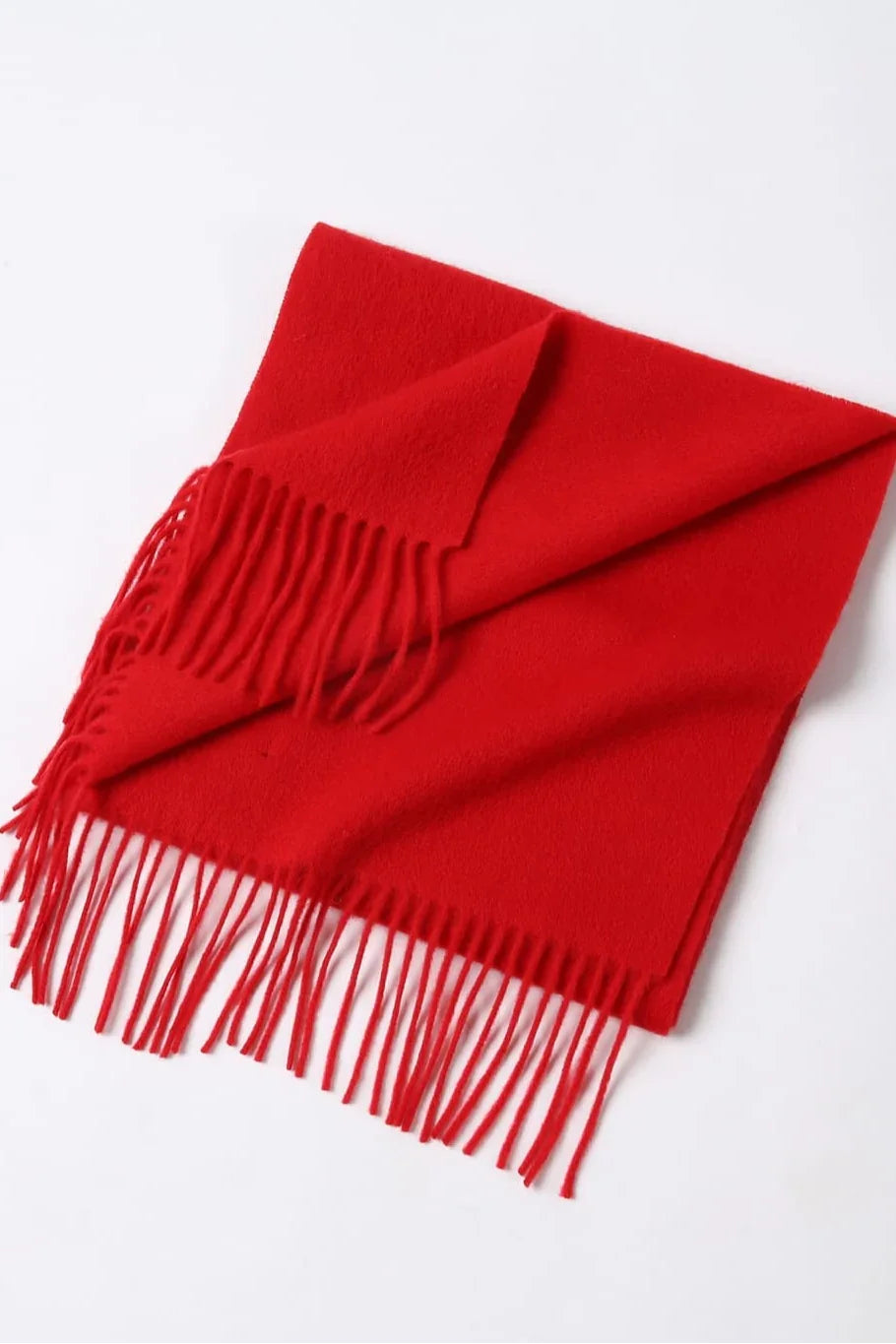 Raving Red scarf folded flat showing its fringe