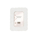 Upright white photo frame with a fluted, scalloped border, holding a printed insert card in the opening.