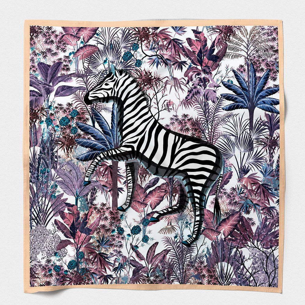 Zebra Purple silk scarf laid flat - a zebra among mauve, plum and indigo jungle foliage inside a soft peach border