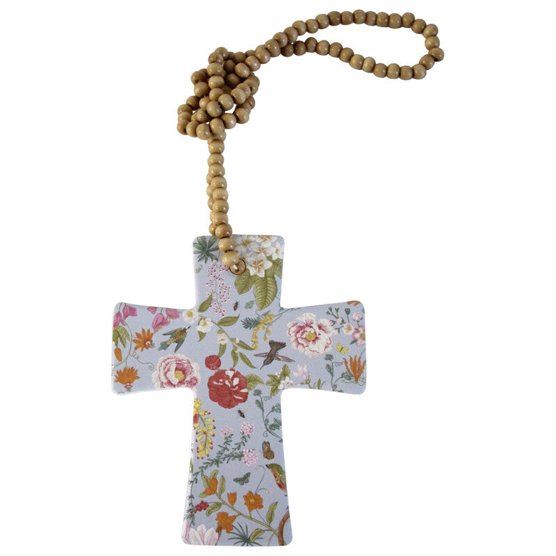 Second angle of the floral ceramic cross showing its wooden bead hanging loop
