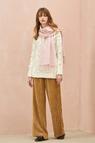 Full-length cream jumper and tan pants look with the Dahlia pink scarf