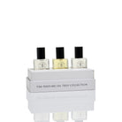 The Perfume Oil Trio gift box open with three 5 ml roll-on bottles standing on the lid