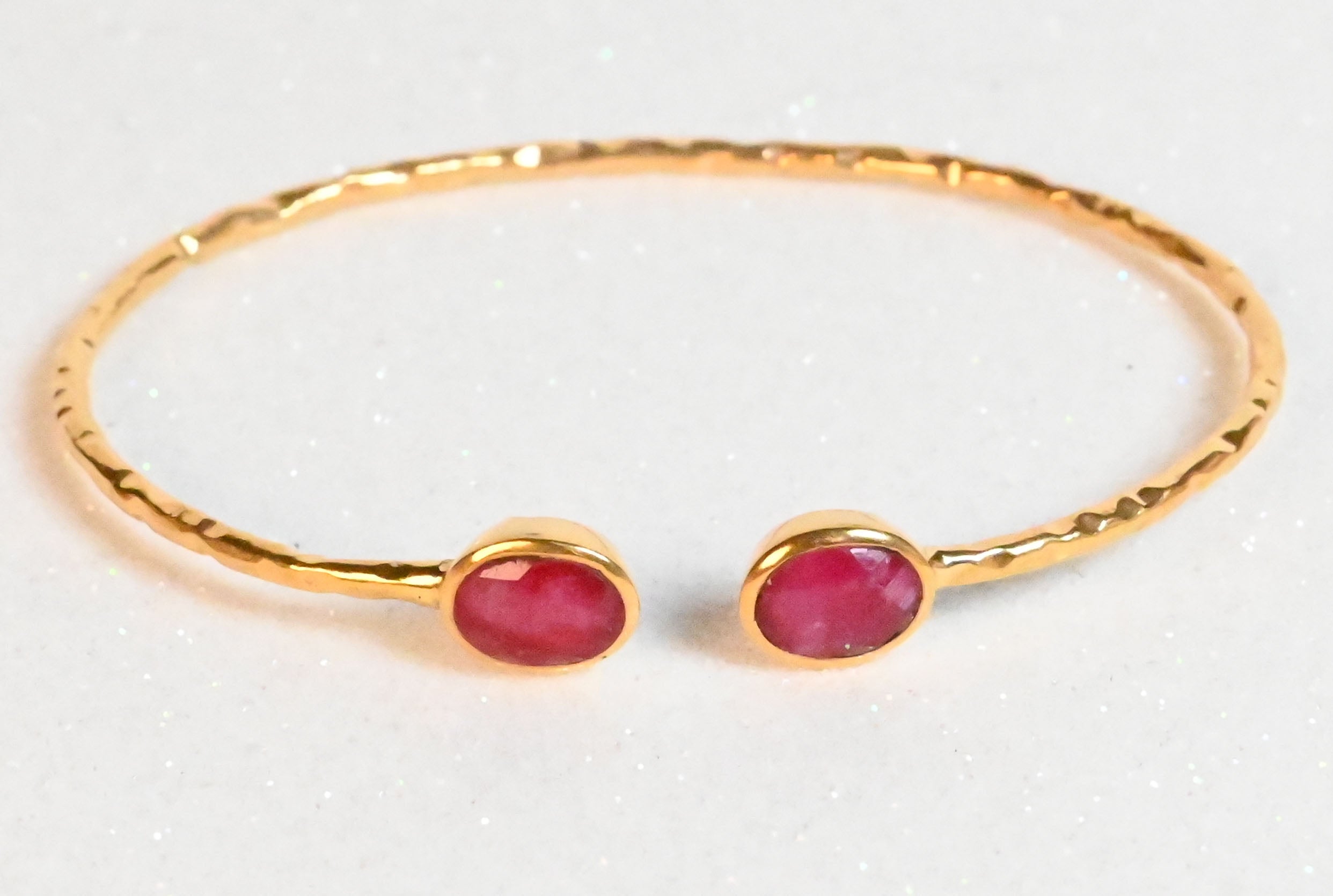 Euro Gold hammered cuff bangle with two rich ruby oval gems