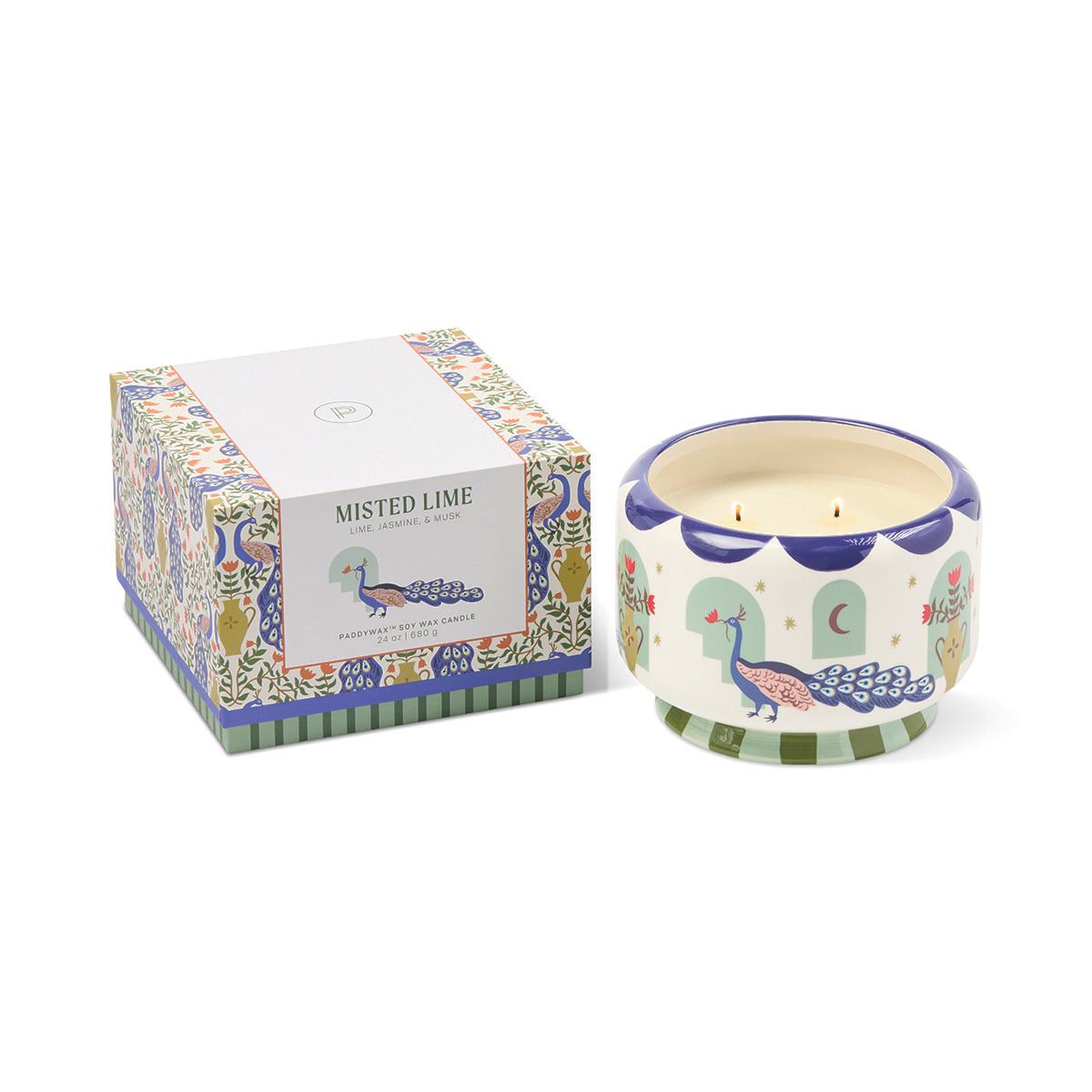 The peacock candle beside its closed gift box with the Misted Lime label.
