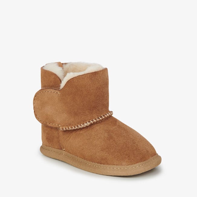 Chestnut baby bootie with touch-tape strap fastened, angled view