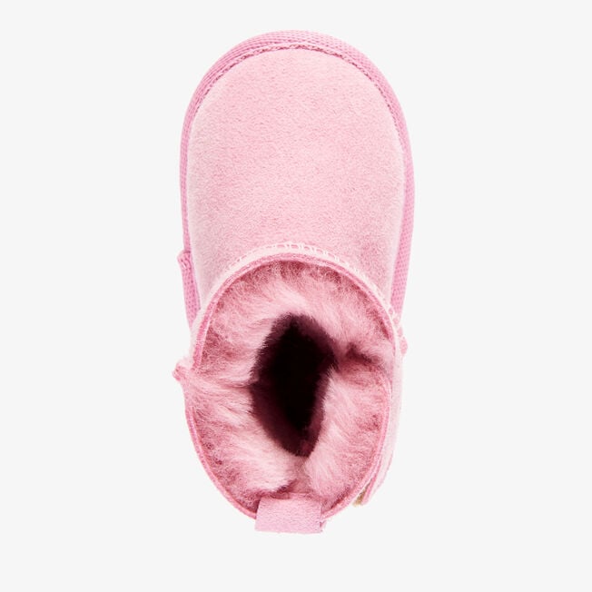 Top-down view of the orchid pink baby bootie showing rosy wool lining