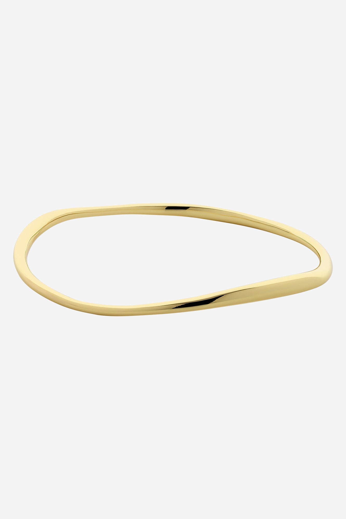 Soft gold bangle with an organic wave shape and a smooth polished finish.