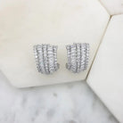 Cubic zirconia cluster earrings viewed from the side on a marble tile