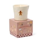 The gingerbread candle sitting on top of its closed pink gift box.