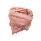 Beauty in Bamboo scarf in Ballerina, a soft blush pink, loosely rolled with fringed edges