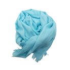 Beauty in Bamboo scarf in Electric Blue, a bright aqua-turquoise, gathered into a soft coil