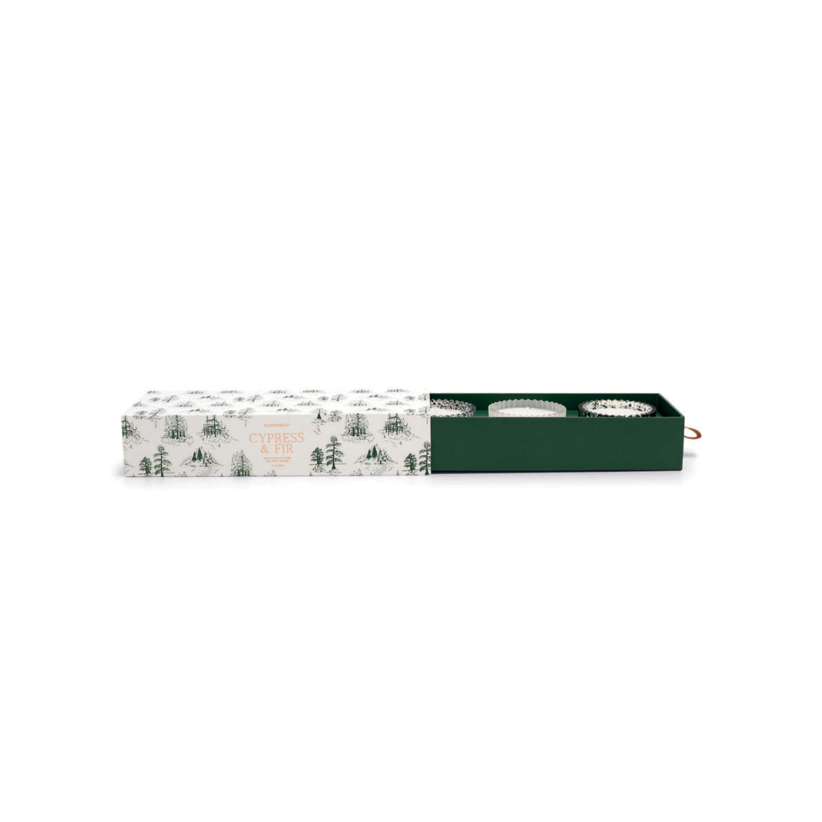 Cream sleeve printed with green pine trees, slid back to show three ribbed candles in a green drawer: two speckled mercury glass, one frosted.