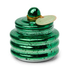 Green mercury glass candle with a ribbed body, a domed lid and a Balsam & Fir tag on gold cord.