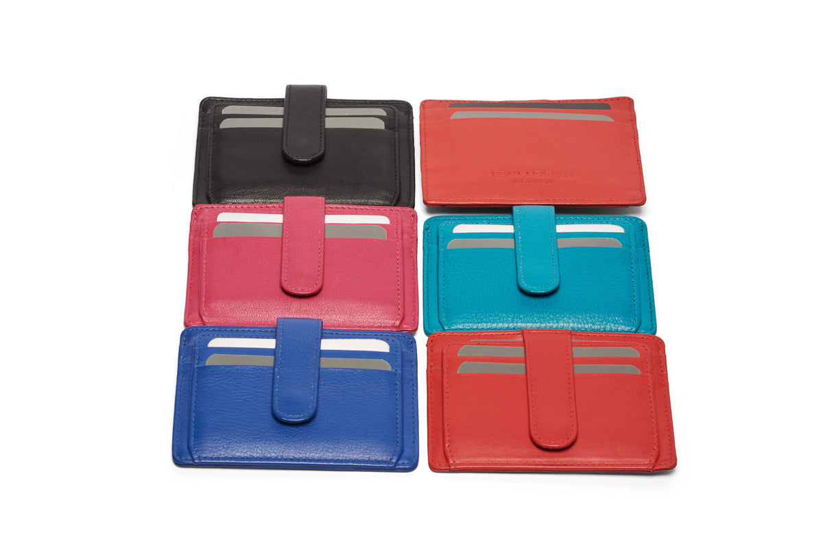 Card holders laid out in two columns in black, coral, pink, aqua, cobalt and red, the coral one turned to show its plain back