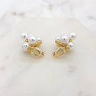 Pearl cluster clip-on earrings turned to show the gold clip fastening
