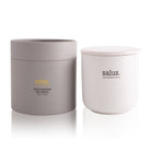 Salus Rose Geranium soy candle in a white lidded jar beside its round grey gift box
