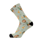 Single sage green crew sock with a black toe, printed with hens, fluffy chicks, eggs and straw nests in cream, orange and brown.