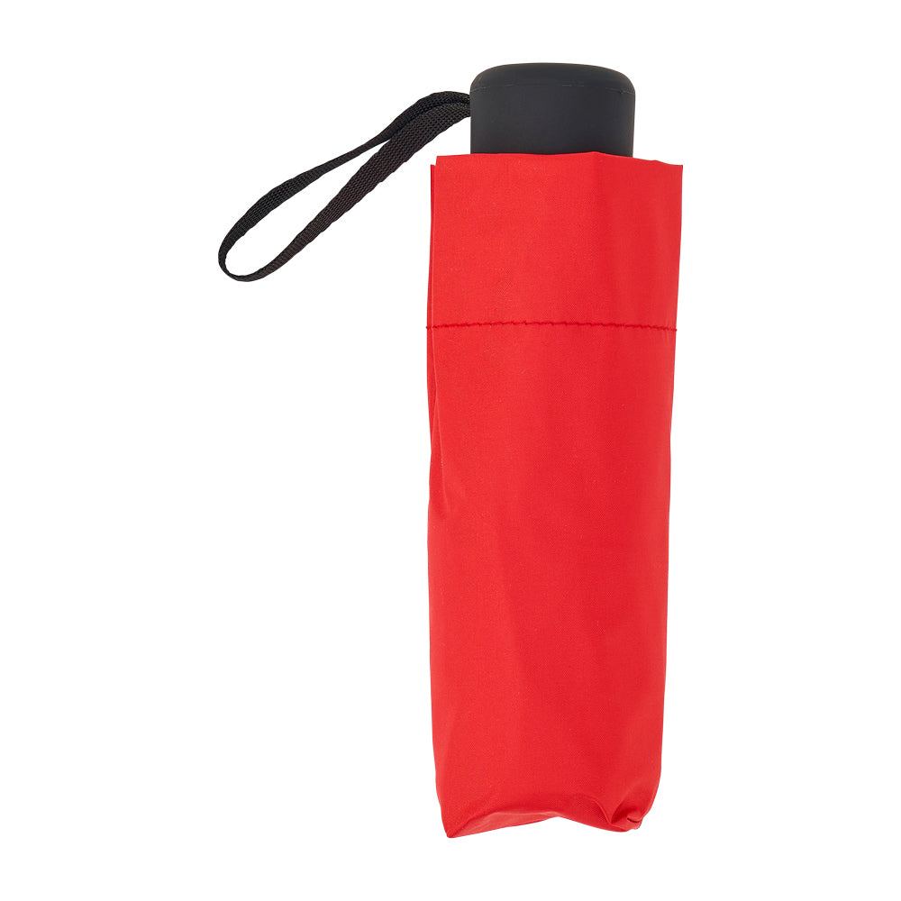 Red folded umbrella standing upright with a black handle and wrist strap.