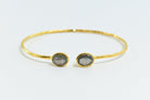 Hammered Euro Gold cuff bangle with two grey labradorite-style oval gems