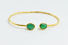 Hammered Euro Gold cuff bangle with two deep green oval gems