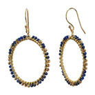 Gold hoop earrings wire-wrapped with deep blue lapis beads