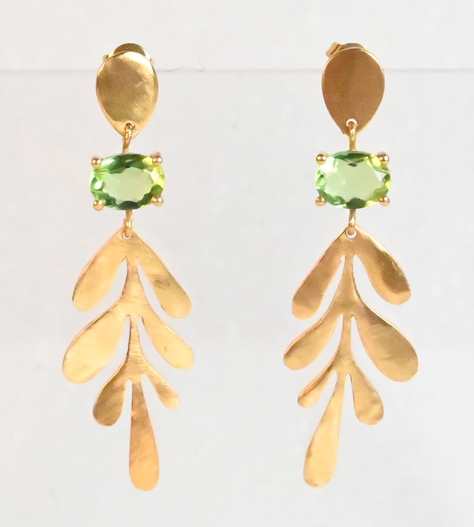 Euro Gold leaf drop earrings with peridot-green oval gems