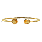 Euro Gold cuff bangle with two citrine gems on a black background