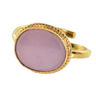 Gold ring with a smooth oval lilac-pink quartz in a beaded bezel