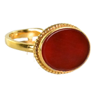 Gold ring with a smooth oval deep red carnelian in a beaded bezel