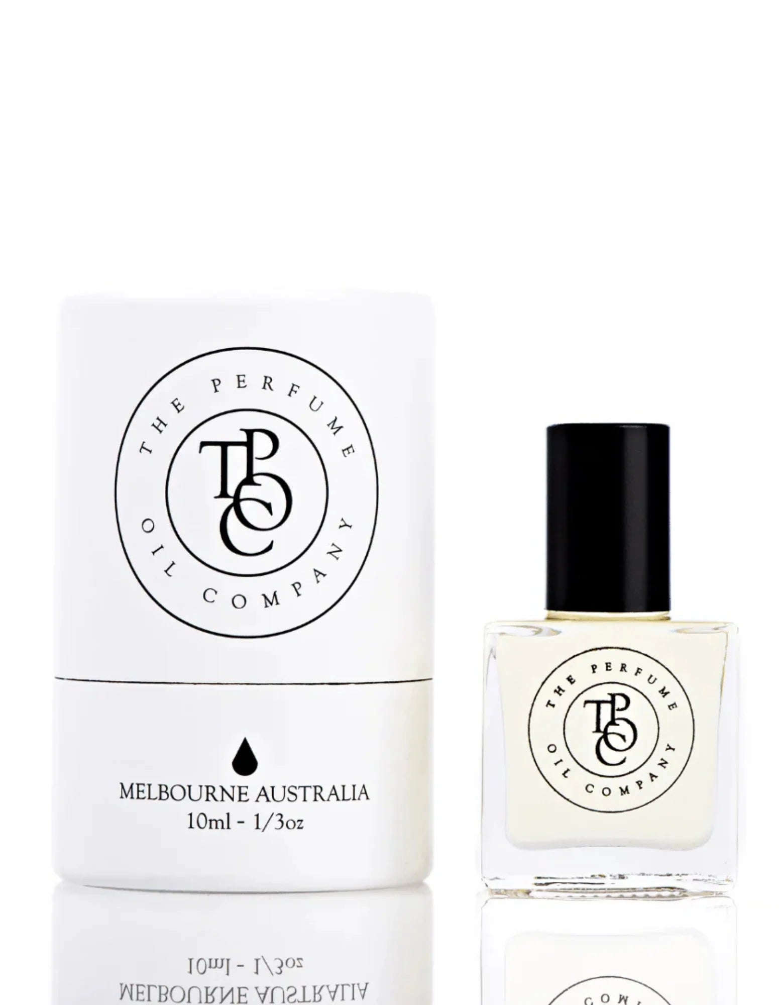 The Perfume Oil Company white gift cylinder beside a 10 ml bottle of perfume oil, studio lit on white