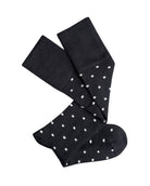 Pair of black knee-high merino socks with small white dots