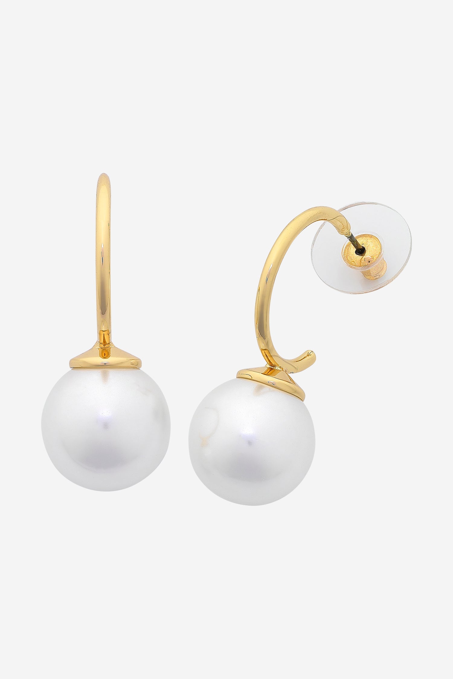 Gold curved hoop earrings, each finished with a large white shell pearl.