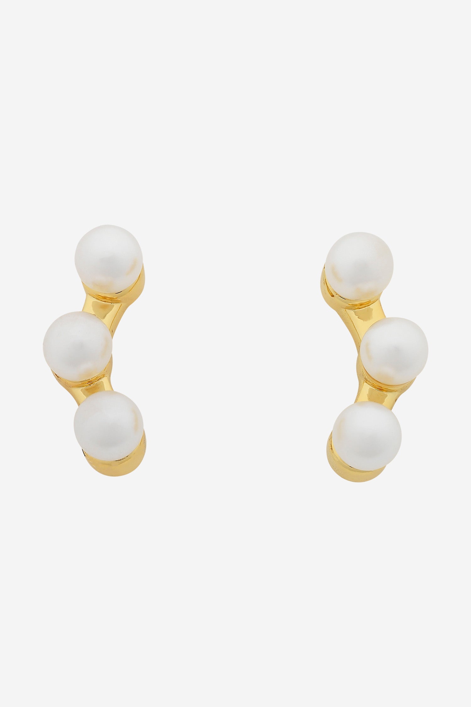 Gold ear-climber studs, each set with three graduated white pearls.