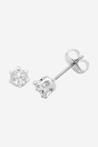 Silver crystal stud earrings in a claw setting, shown with butterfly backs.