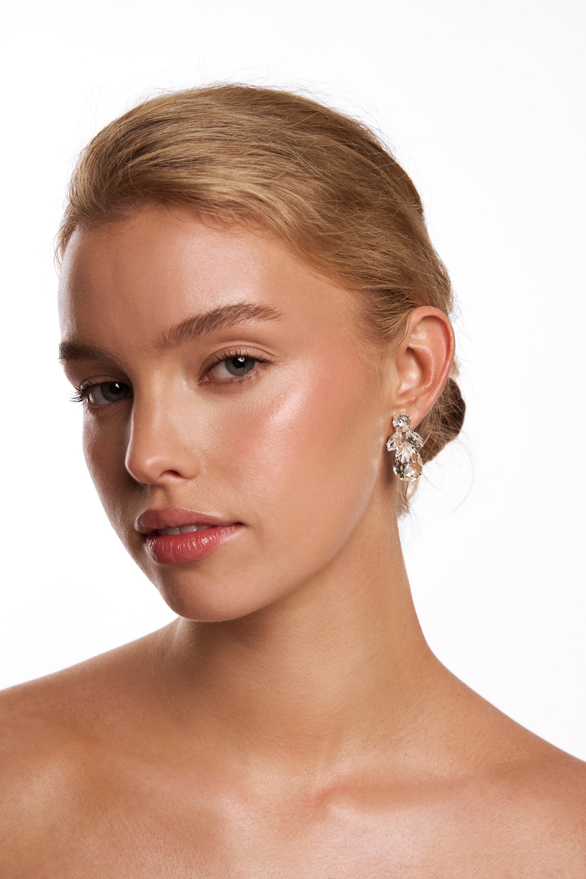Model wearing the Kitt tiered crystal drop earring.