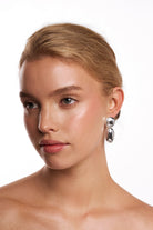 Model wearing the Malibu silver drop earring.