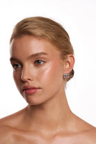 Model wearing the Teddie silver triple hoop.