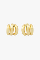 Gold triple-hoop earrings that create a layered look from a single post.