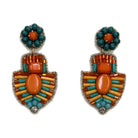 A pair of beaded drop earrings. Each has a round stud of teal beads around an orange centre stone, hanging to a shield-shaped drop of orange, mustard and turquoise bugle beads set around a large oval orange cabochon, edged in gold thread with a clear crystal at the lower point.