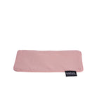 Flat view of the blush pink Salus eye pillow with removable cover and Salus tag