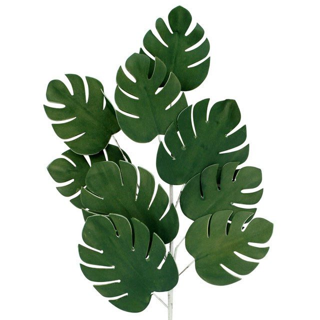 Artificial monstera stem with a cluster of split green leaves on a pale stem