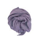 Beauty in Bamboo scarf in Wild Grape, a soft lavender purple, gathered into a coil