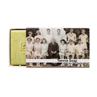 Green soap bar sliding out of a sleeve printed with a vintage black and white tennis team photo, labelled Tennis Soap