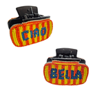 Two black claw hair clips in red and yellow beadwork, one reading CIAO and one reading BELLA.