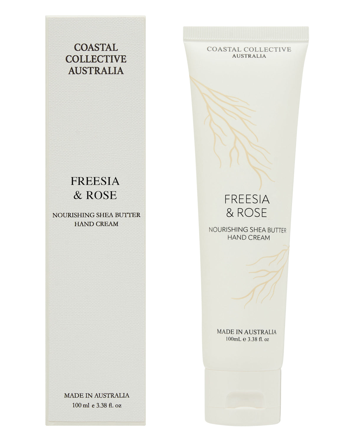 Coastal Collective Freesia & Rose hand cream, the cream tube standing beside its tall grey box, both printed with a pale gold botanical sprig.