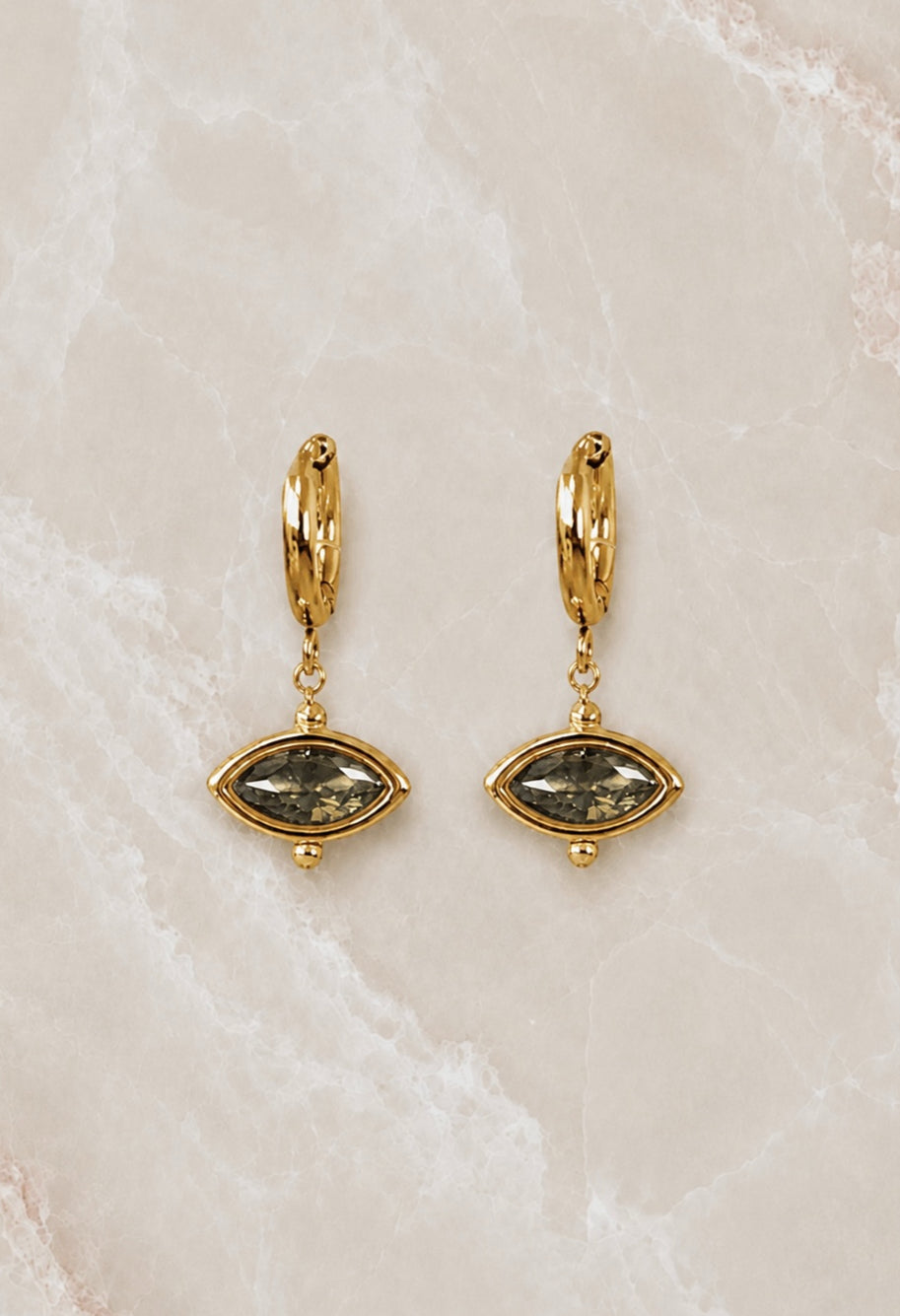 Gold huggie hoop earrings with an olive-green marquise stone drop set in a beaded gold frame
