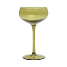 Olive green coupe glass with a finely ribbed bowl and a tall, slim stem.