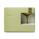 The same box from the front, the olive coupe standing in the window.